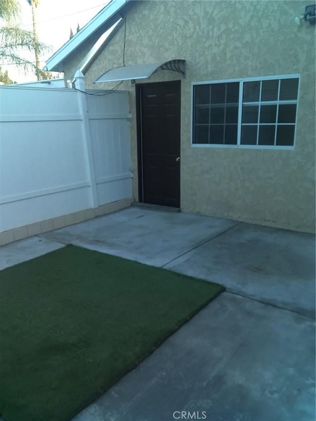 entrance to property with a patio area