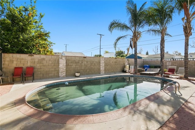 view of swimming pool with a patio