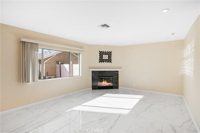 living room with a tiled fireplace