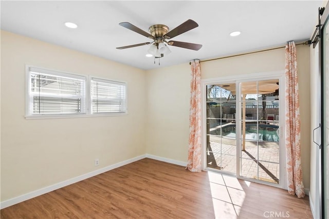 unfurnished room featuring ceiling fan and light hardwood / wood-style floors