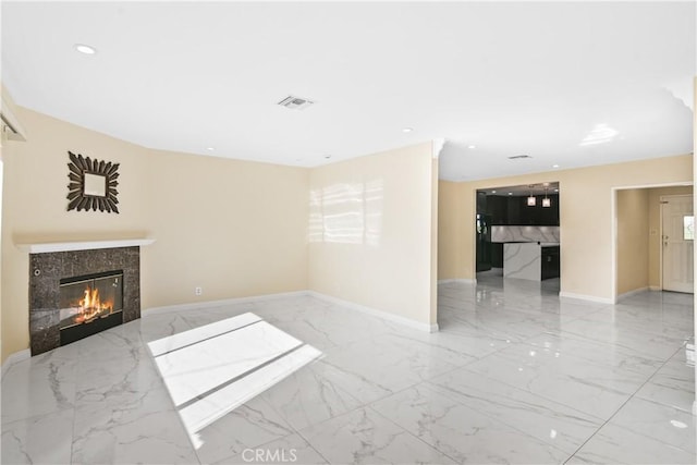 unfurnished living room featuring a fireplace