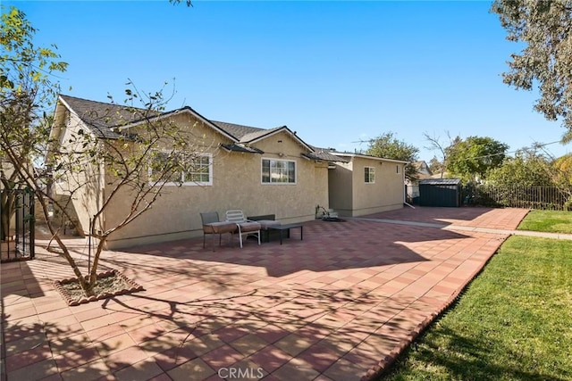 rear view of property featuring a patio