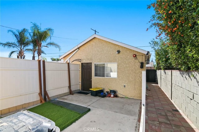 rear view of property featuring a patio