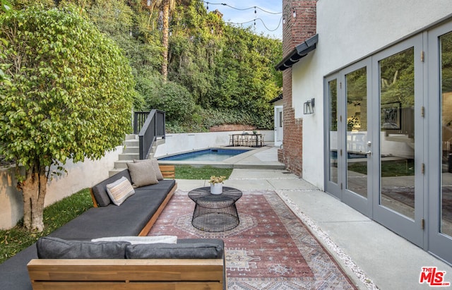 view of patio / terrace with an outdoor hangout area and french doors