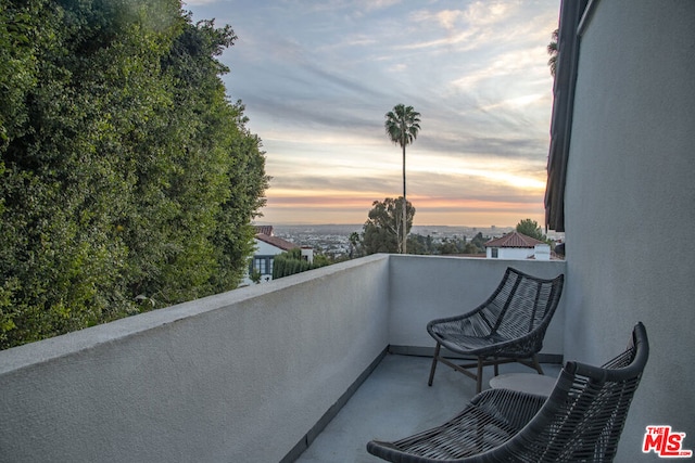 view of balcony at dusk