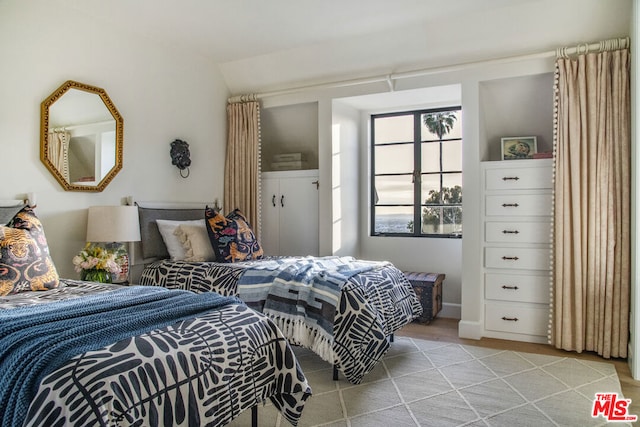 bedroom featuring lofted ceiling