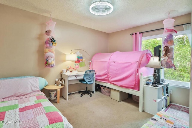 carpeted bedroom featuring a textured ceiling