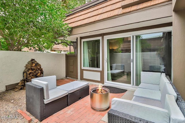 view of patio / terrace featuring an outdoor fire pit