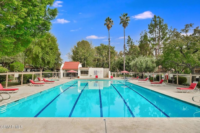 view of swimming pool featuring a patio area