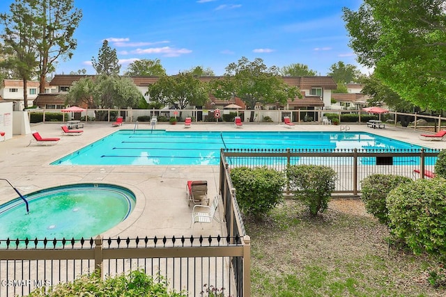 view of swimming pool with a patio area