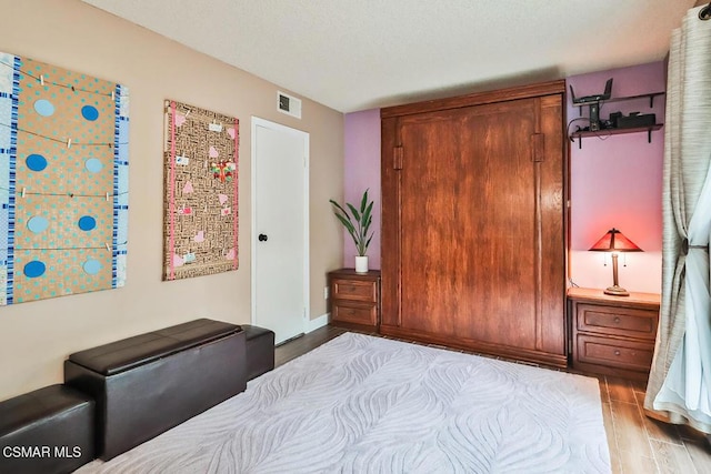 bedroom with light hardwood / wood-style flooring