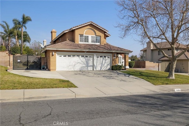 view of property featuring a garage and a front lawn