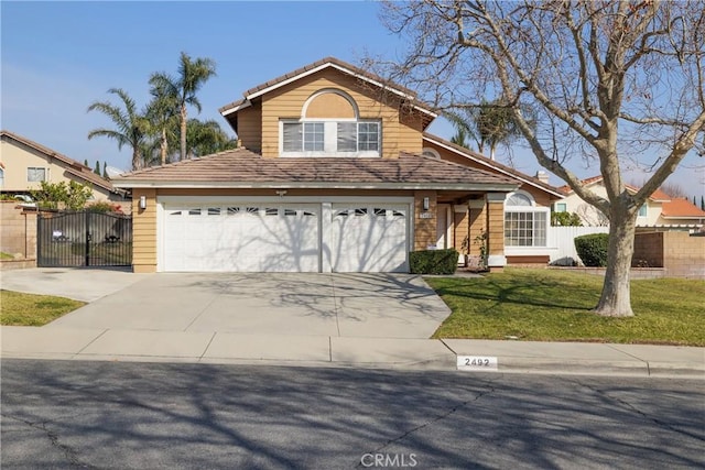 front of property featuring a garage and a front yard