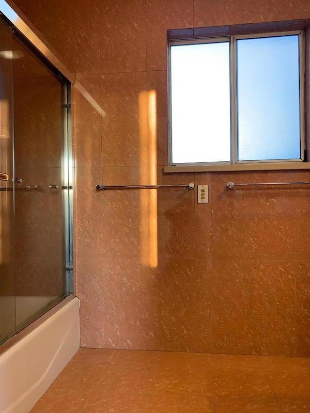 bathroom featuring enclosed tub / shower combo