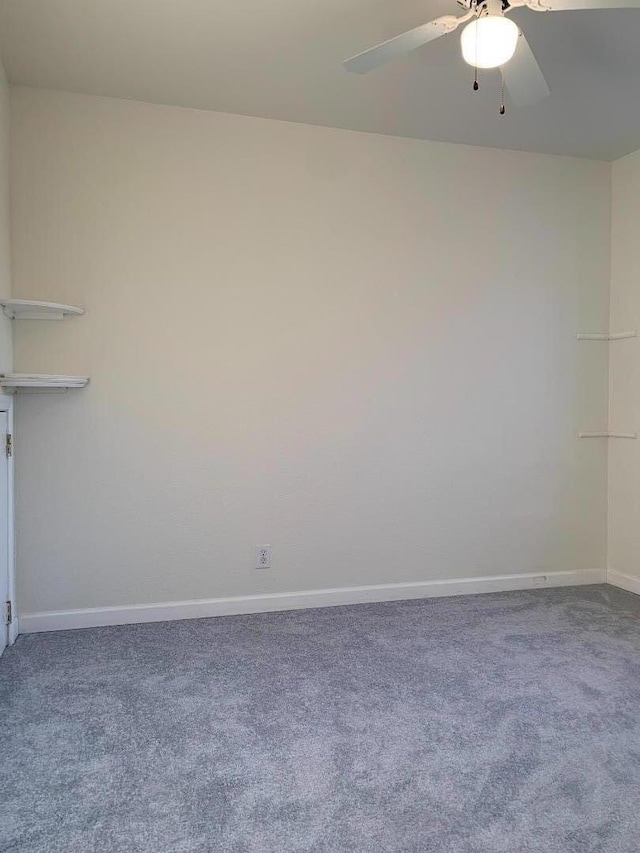 unfurnished room with ceiling fan and carpet flooring