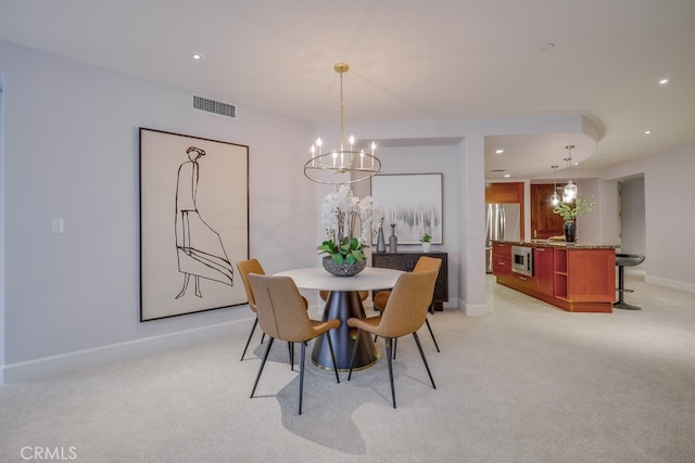 dining space with recessed lighting, visible vents, baseboards, and light colored carpet