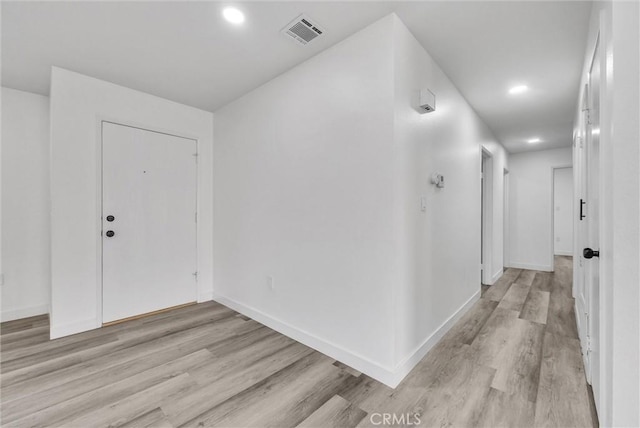 foyer entrance with light wood-type flooring