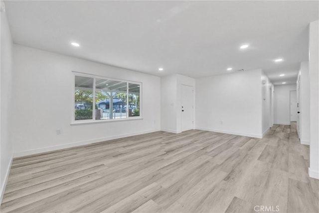 unfurnished living room featuring light wood-type flooring