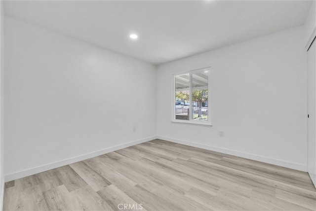 empty room with light hardwood / wood-style floors