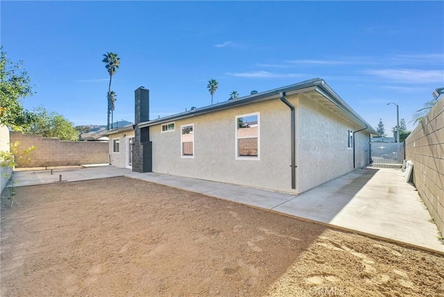 rear view of property with a patio area