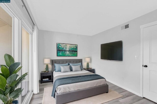 bedroom with hardwood / wood-style flooring