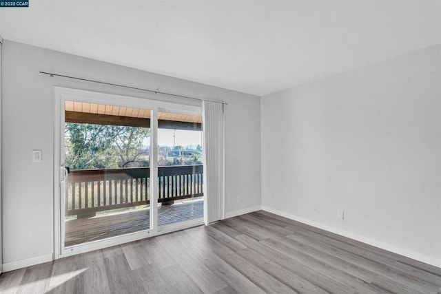 unfurnished room featuring light wood-type flooring