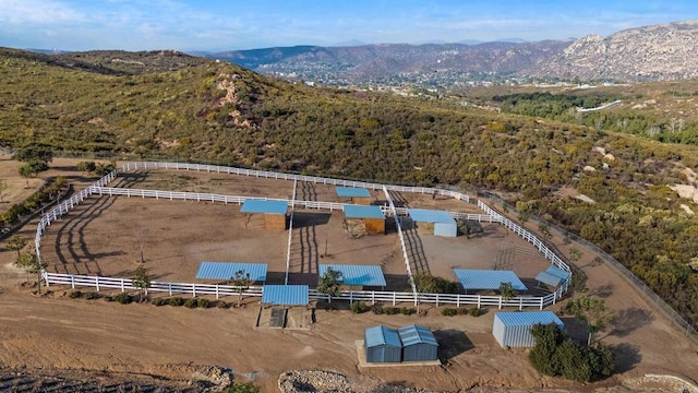 birds eye view of property with a mountain view and a rural view