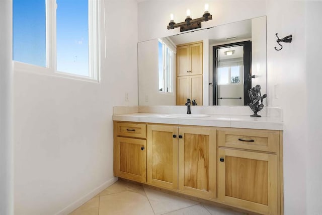 bathroom with tile patterned flooring and vanity