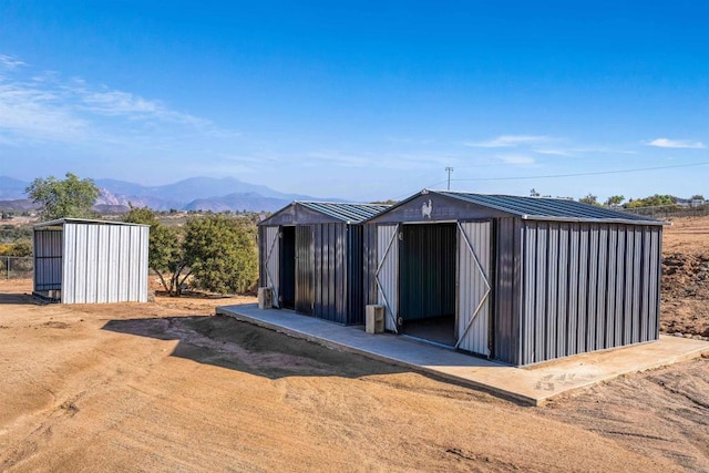 view of outbuilding with a mountain view