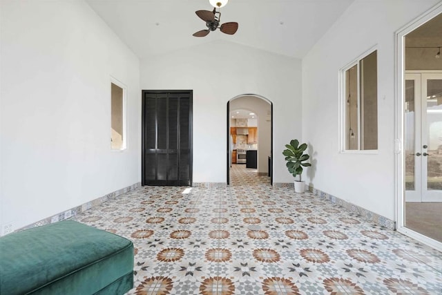 interior space with ceiling fan