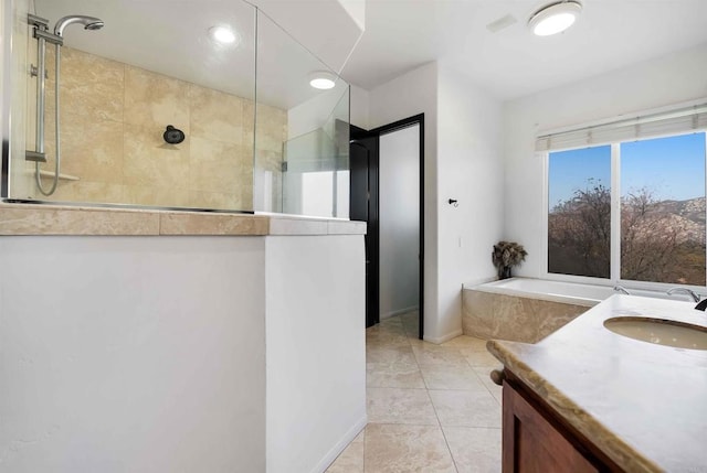 bathroom with vanity, shower with separate bathtub, and tile patterned flooring