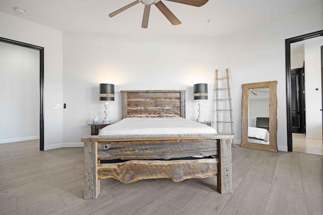 bedroom with ceiling fan and light hardwood / wood-style flooring