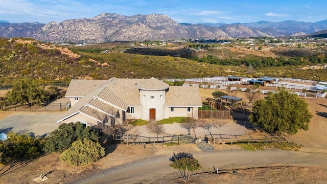 birds eye view of property with a mountain view