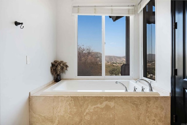 bathroom with tiled tub