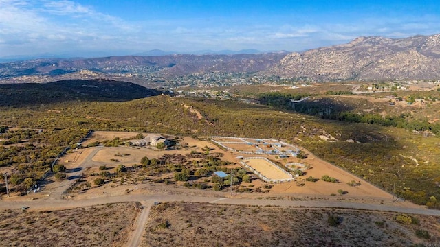 birds eye view of property with a mountain view