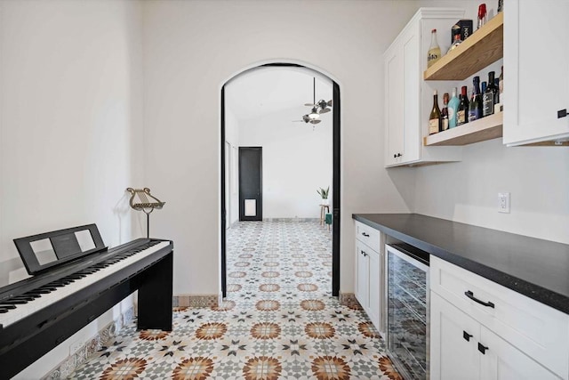 kitchen with wine cooler and white cabinets