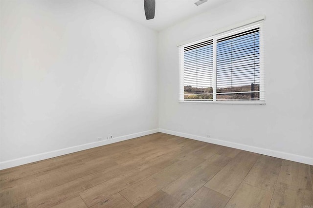 empty room featuring ceiling fan and light wood-type flooring