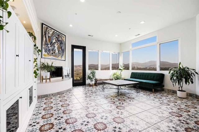 interior space with a mountain view and plenty of natural light