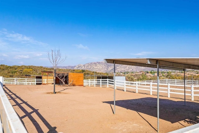 exterior space with a rural view and a mountain view