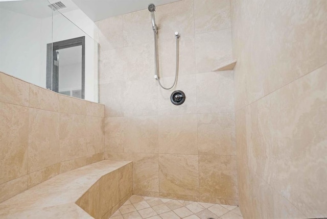 bathroom with tiled shower