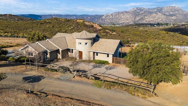 birds eye view of property with a mountain view