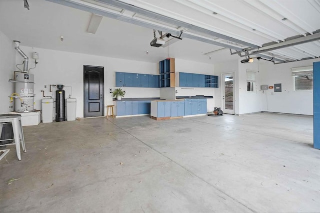 24916 Bareta Star Ranch Rd, Ramona, CA 92065 - garage with a garage door opener, water heater, and electric panel