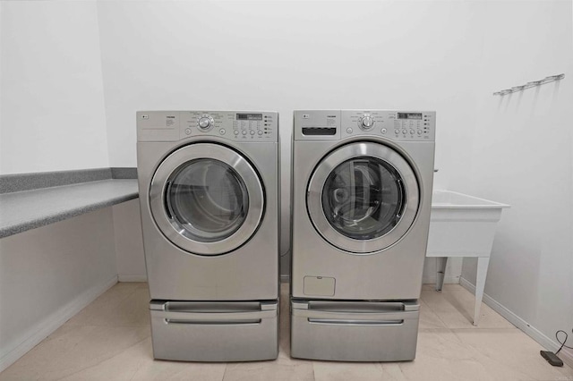 24916 Bareta Star Ranch Rd, Ramona, CA 92065 - washroom with separate washer and dryer and baseboards