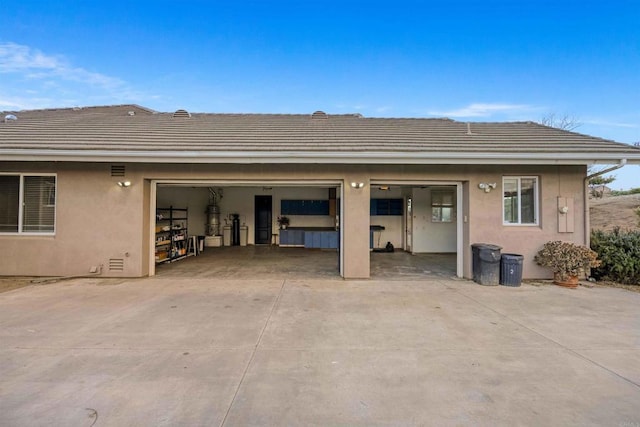 24916 Bareta Star Ranch Rd, Ramona, CA 92065 - back of property with stucco siding, a tile roof, and concrete driveway