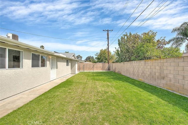 view of yard with a fenced backyard