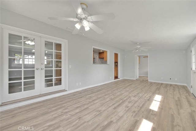 unfurnished living room featuring light wood-style flooring, french doors, baseboards, and ceiling fan