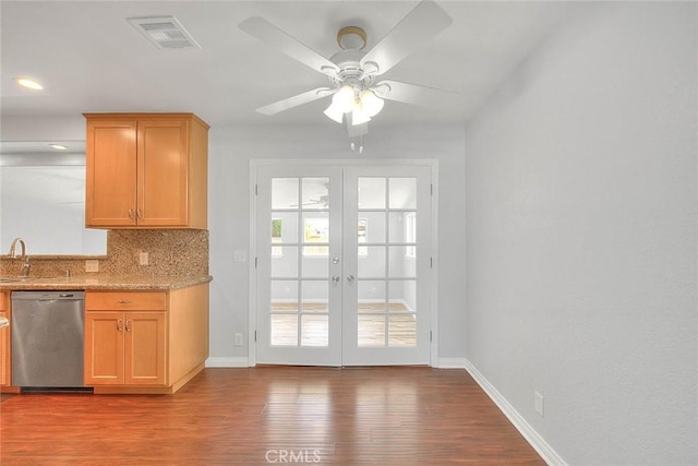 kitchen with wood finished floors, visible vents, decorative backsplash, french doors, and dishwasher