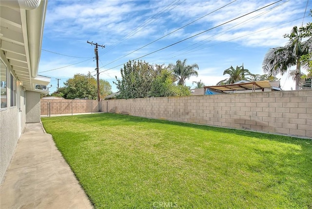 view of yard featuring a fenced backyard