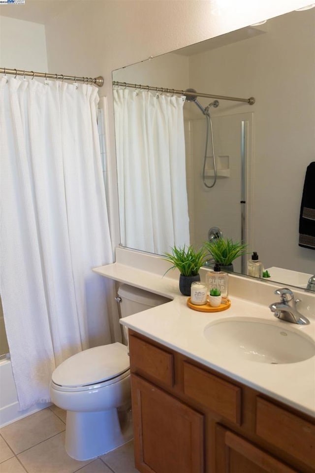 full bathroom with shower / bath combo, vanity, tile patterned floors, and toilet