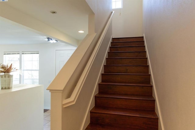 staircase with tile patterned floors